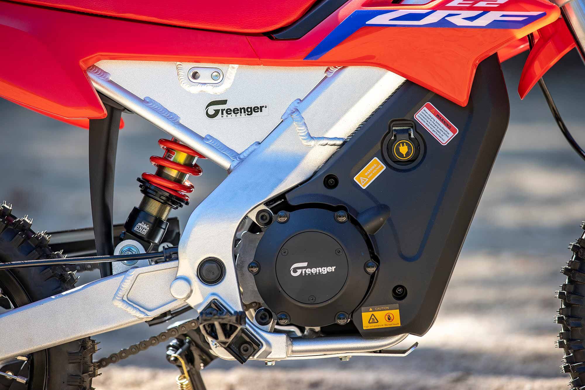 CRF-E2 battery uses a separate charger that plugs into a convenient port on the right side. The standard 5-amp charger tops a fully depleted battery in four hours.