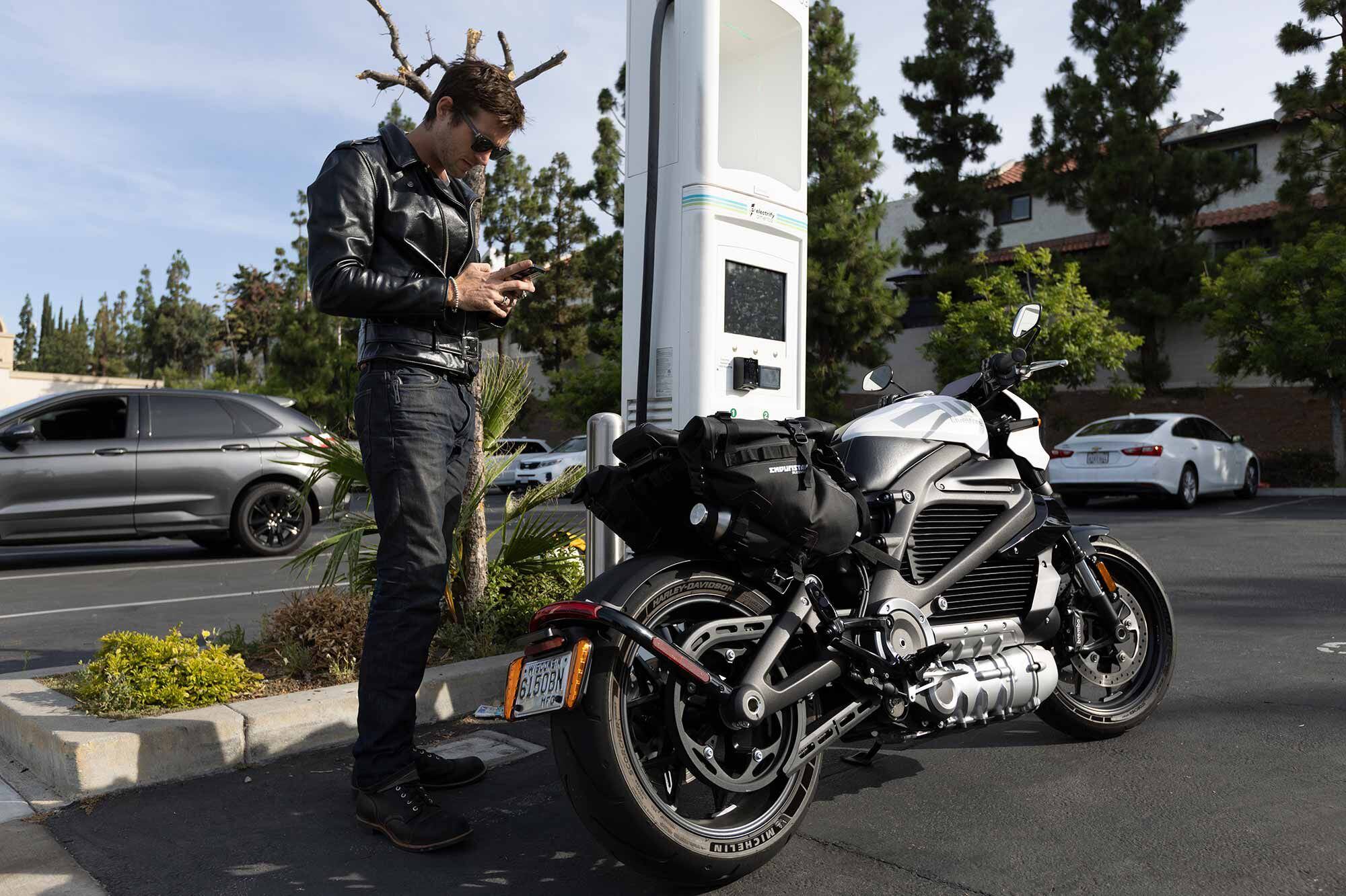 Electrify America charging stations are often found in the parking lots of shopping centers and outlet malls.
